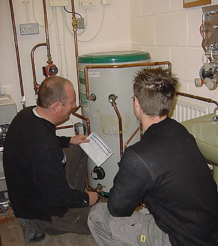 Image of people and boiler
